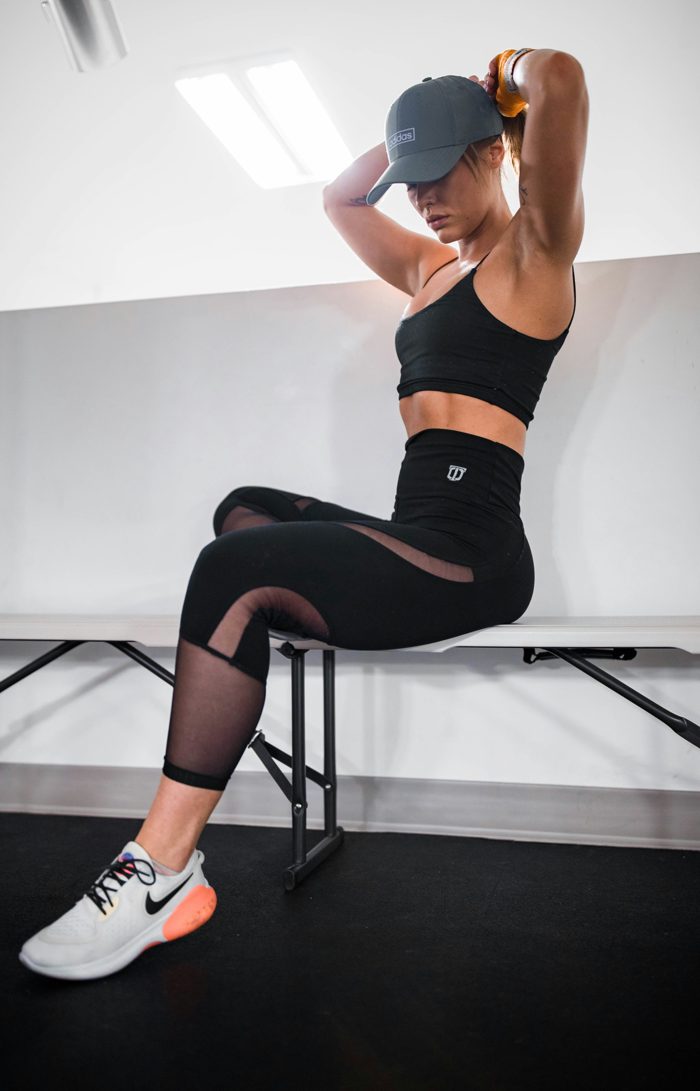 A woman resting between strength exercises